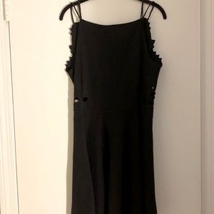 Large Free People black mini dress with cutouts